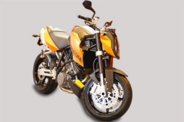 O sistema de travagem constituído por disco e pastilhas, em motociclos, permite: — pergunta R13Q0074 do exame de código IMT
